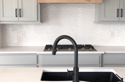 White subway tile backsplash herringbone